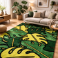 Living room with a green and yellow leaf-patterned rug, sofa, and decor.