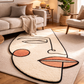 Abstract face rug on a wooden floor with a living room setting
