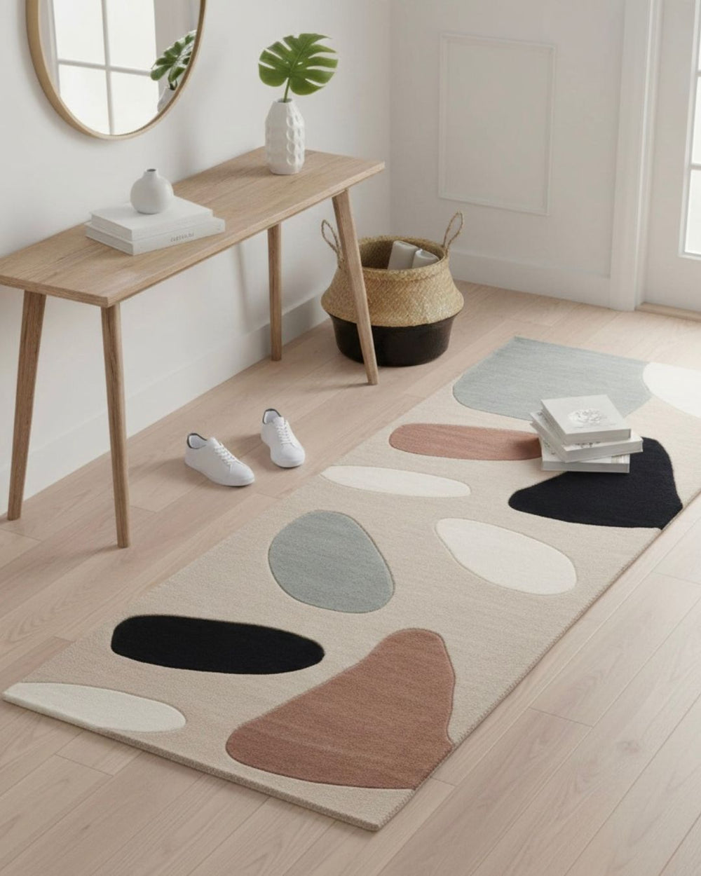 Modern room with a patterned rug, wooden table, and decor items.