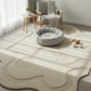 Modern living room with a round gray pet bed on a large beige rug.
