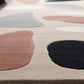 Colorful abstract rug with geometric shapes on a light background