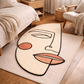 Abstract face design rug on a wooden floor in a bedroom setting