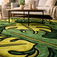 Green and yellow patterned rug in a living room setting with a coffee table and couch.