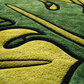 Close-up of a green and yellow textured surface with abstract design