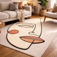 Abstract face rug on a wooden floor with a living room setting