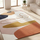 Colorful abstract rug on a light wooden floor with a modern living room setting.