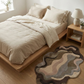 Bedroom with a bed, nightstand, and decorative rug.