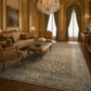 Luxurious living room with ornate furniture, chandelier, and large rug.