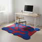 Colorful wavy rug on a wooden floor with a desk and chair in the background.