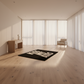 Modern room with a rug featuring text on a wooden floor.