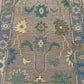 Close-up of a patterned fabric with floral and geometric designs.