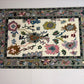 Decorative rug with floral patterns on a white floor