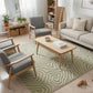 Modern living room with a patterned rug, gray chairs, and a wooden coffee table.