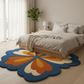 Floral patterned rug in a bedroom with a bed and window.
