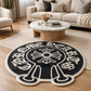 Round black rug with white text and design in a living room setting