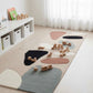 Colorful play rug with wooden toys on a light wood floor in a room with white curtains.