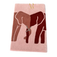 Pink towel with elephant design and 'AR' logo on a white background