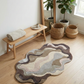 Rug with wavy pattern on wooden floor in room with plants and bench