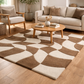 Living room with a patterned rug, sofa, and coffee table.