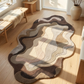 Wavy patterned rug on a wooden floor with natural light