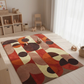 Colorful geometric-patterned rug on a wooden floor with toys around