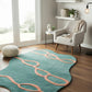 Teal rug with pink patterns in a living room setting