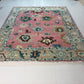 Decorative rug with floral patterns on a white floor