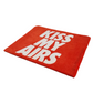 Red mat with 'KISS MY AIRS' text on a white background