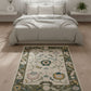 Decorative rug with floral pattern on a wooden floor in a bedroom setting
