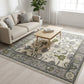 Living room with a patterned rug, sofa, and coffee table.