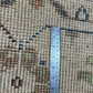 Rug with a ruler for scale showing the pattern and texture
