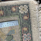 Rug with floral patterns and a ruler for scale