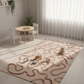 Children's playroom with a maze rug, wooden table, and chairs.