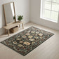 Decorative rug with floral pattern on a light wooden floor, with a bench and mirror in the background.