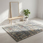 Decorative rug with floral pattern in a room with a bench and plant