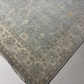 Decorative rug with floral patterns on a light gray floor