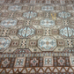 Close-up of a patterned rug with geometric designs.