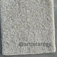 Soft and inviting rug with a sand-like appearance and glazed finish
