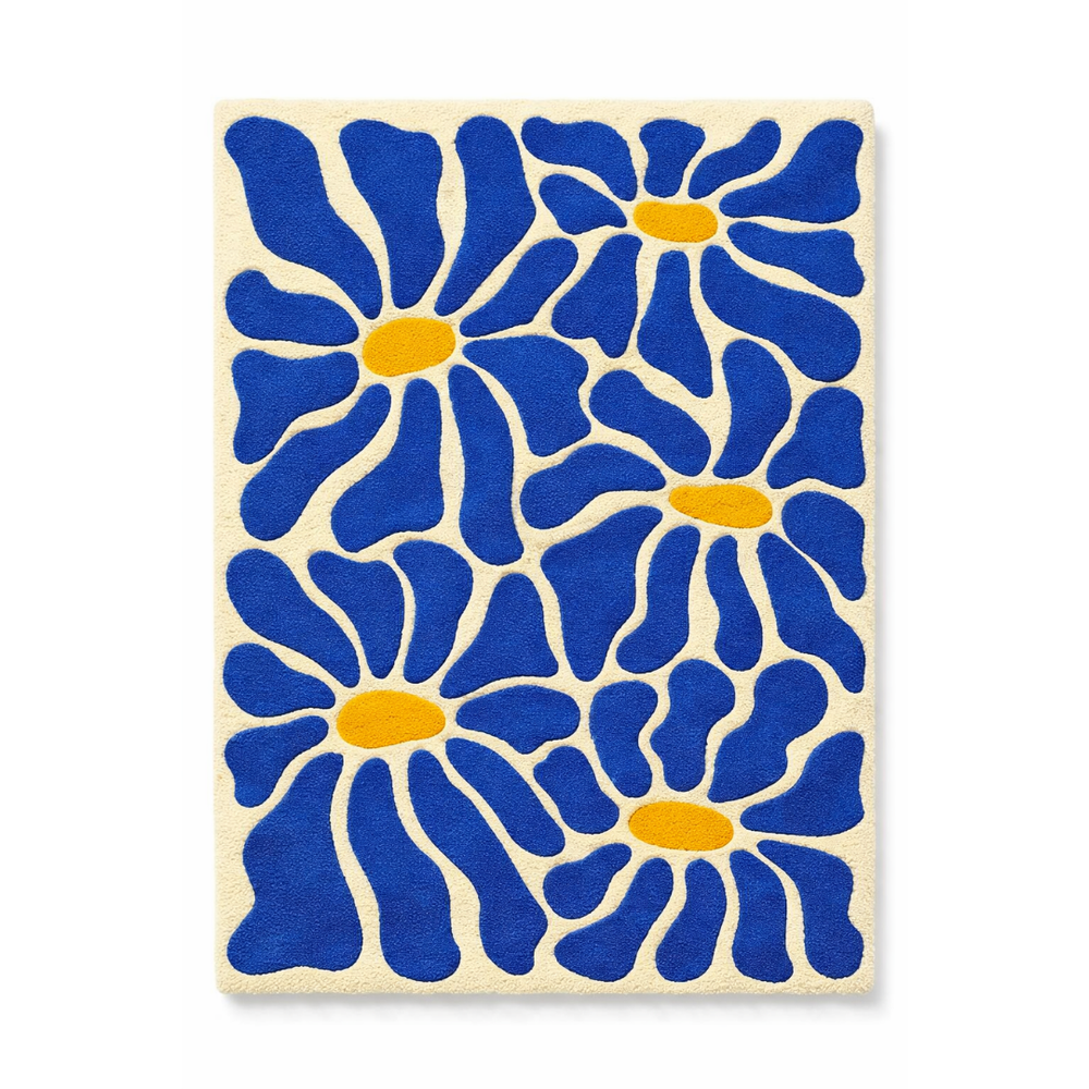 Decorative tile with blue floral pattern on a beige background