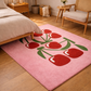 Pink rug with red tulip design in a bedroom setting