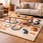 Living room with a colorful geometric rug, wooden coffee table, and beige sofa.