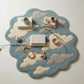 Round blue rug with cloud patterns on a white background