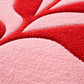 Close-up of a textured pink and red fabric surface