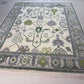 Decorative rug with geometric pattern on a tiled floor