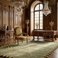 Luxurious interior with ornate furniture, chandeliers, and large windows.