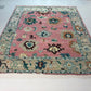 Decorative rug with floral patterns on a white floor