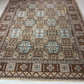 Decorative rug with geometric pattern on a white floor