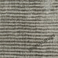 Textured rug with repeating parallel wave designs for a contemporary touch