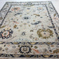 Decorative rug with intricate patterns on a white floor