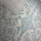 Close-up of two patterned rugs with intricate designs.